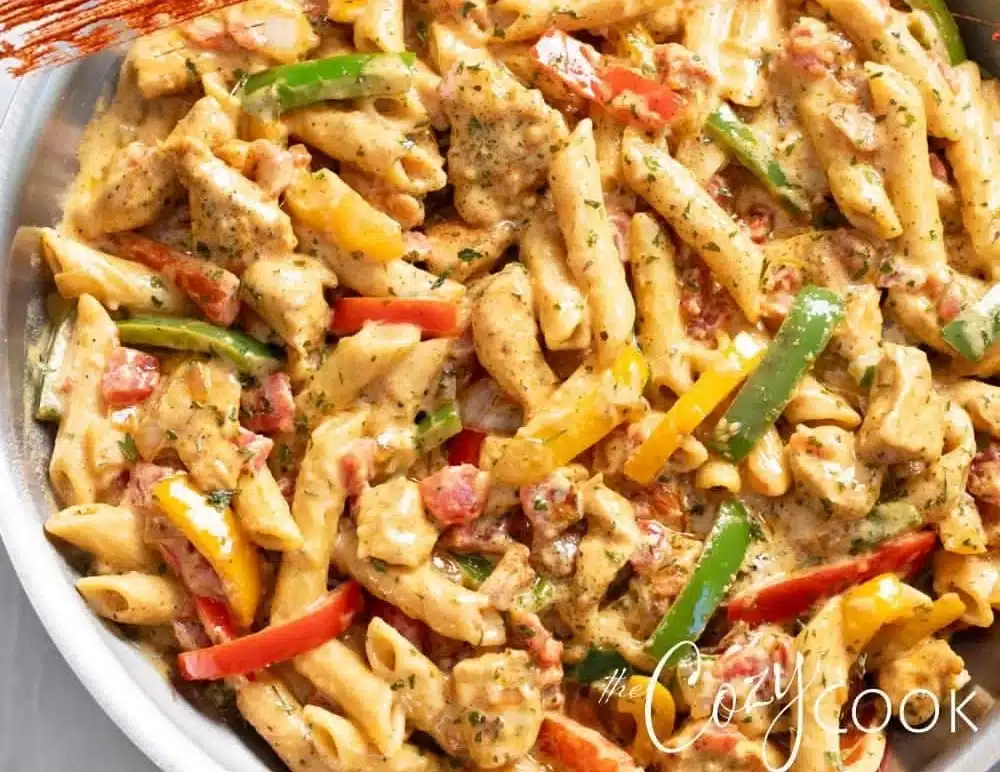 This Chicken Fajita Pasta is a flavor explosion! It has penne pasta smothered in a mouth-watering sauce with diced tomatoes.
