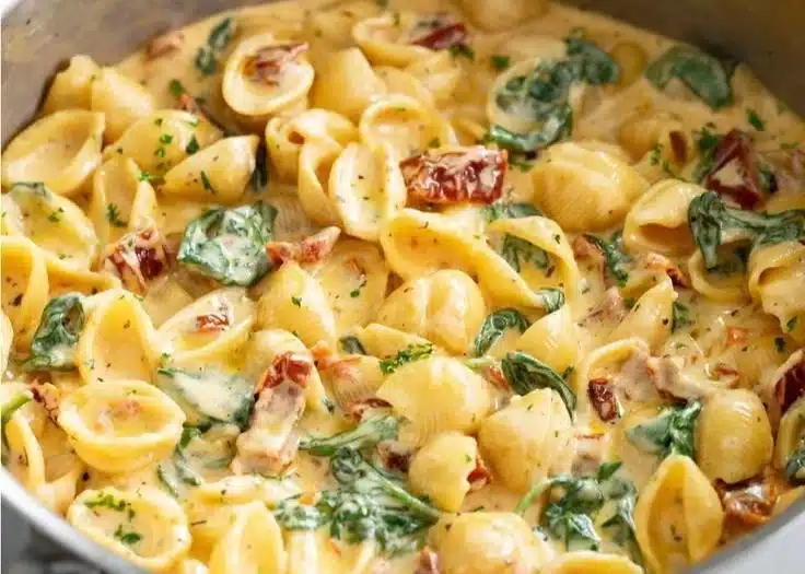 Delicious bowl of Tuscan Mac and Cheese topped with herbs and cheese